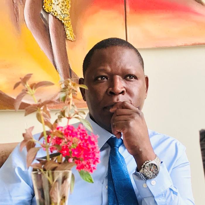 Dr. Imbenzi George